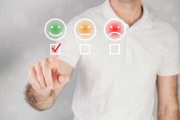 Man giving rating, leaving review with a happy face emotion icon. Product quality survey. Feedback concept.