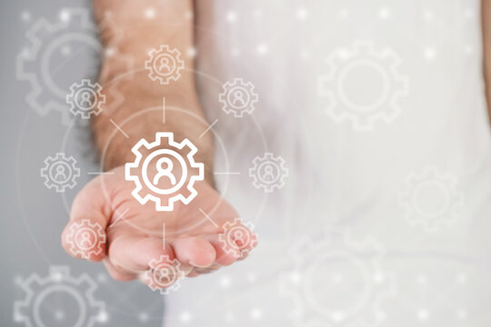 Setting concept, man holds setting icon