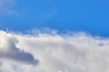 texture of fluffy clouds against a blue sky and fresh air