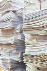 bundles bales of paper documents. stacks packs pile on the desk in the office