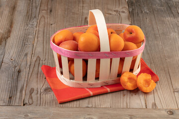 Wooden basket of ripe apricots