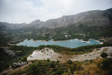 Fototapeta premium Beautiful summer mountain lake view and sunshine in sky. Photography of a Beautiful natural vacation hiking walking travel