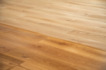 Comparison of luxury oak parquet flooring before and after application of oil-based floor finish,...