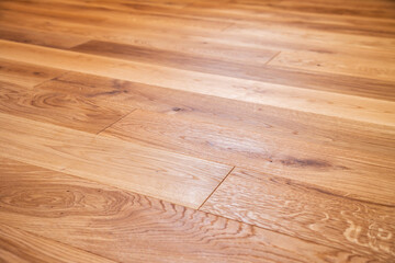 Luxury oak parquet flooring after the application of oil-based floor finish, which tends to enhance the appearance of parquet - obrazy, fototapety, plakaty