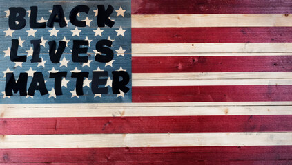 Black lives matter concept on United States vintage wooden flag background
