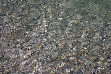 Small stones under the water surface