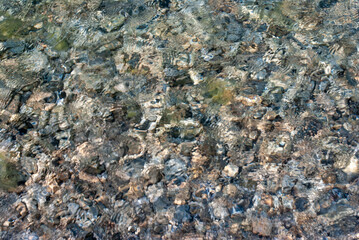 Small stones under the water surface