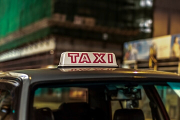 Closeup of a taxi sign at night  at Hong Kong
