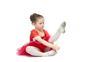 Little ballerina in a red dress on a white background © Alex