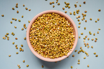 Uncooked Green Buckwheat in a light bowl