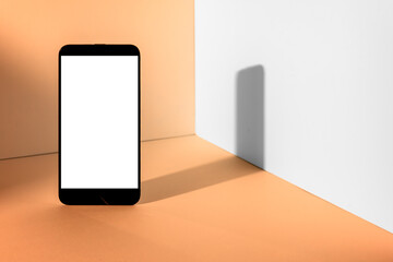 Standing phone Mockup on minimalistic showcase, with abstract and geometric shapes on background