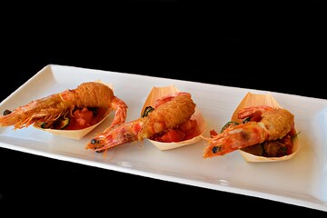 close up of shrimp in kataifi pasta and vegetables, typical dish of Greek and Middle Eastern cuisine