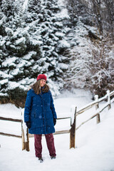 A young woman in winter clothes enjoying a cold day in Colorado, USA