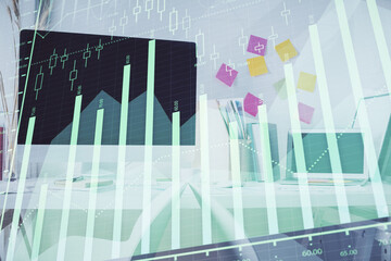 Double exposure of financial graph drawing and office interior background. Concept of stock market.