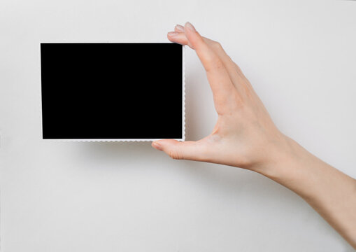 girl holds a photo frame in her hand.copy space
