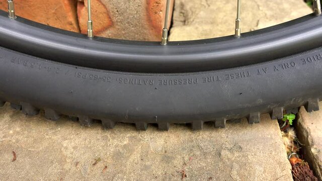 Mountain bike tyre going flat, close up