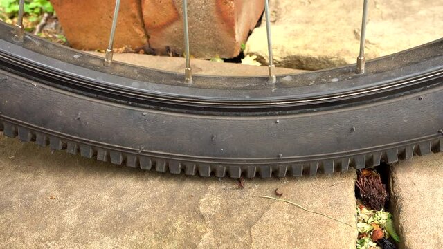 Medium mountain bike tyre going flat, close up.