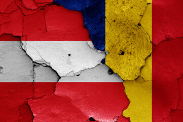 flags of Austria and Romania painted on cracked wall