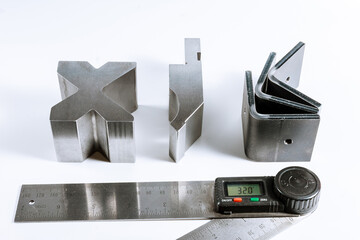 Sheet metal bending tool and equipment isolated on a white. Bend tools, press brake punch and die....
