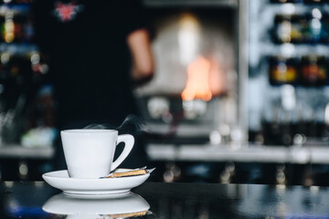 cup of coffee on a table inside a coffee shop