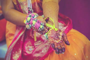 Indian Hindu Haldi ceremony hand decorations and henna mehendi hands close up