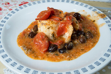 Cod with fresh tomato and olives