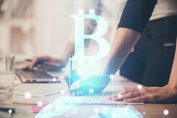 Double exposure of woman hands typing on computer and crypto market theme hologram drawing. Blockchain concept.