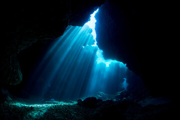 Rays of sunlight into the underwater cave - Powered by Adobe