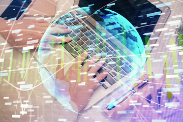 Double exposure of woman hands typing on computer and business theme hologram drawing. Success concept.