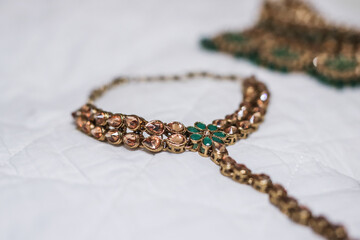 Indian Hindu bride's wedding jewellery, necklace, ear rings close up
