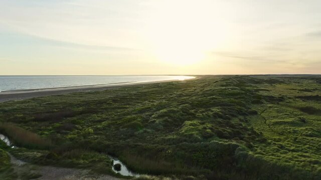 Lush Green Fields by the Slettestrand Beach and Coast During 5AM Sunrise, Denmark