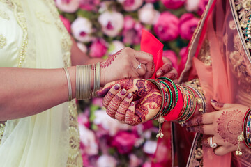 Fototapeta na wymiar Indian Hindu bride's wearing her jewellery close up