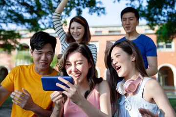 young asian teen use smartphone