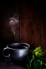 coffee with steel cup and wood background 