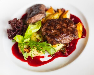 grilled duck steak with cowberry sauce and potato