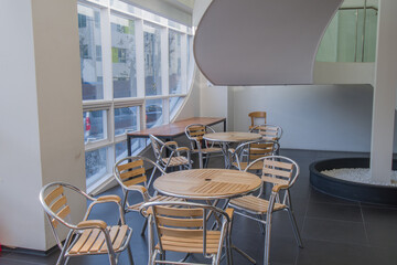 Brightly lit study area with large windows