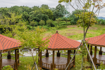 Three covered wooden picnic gazebos