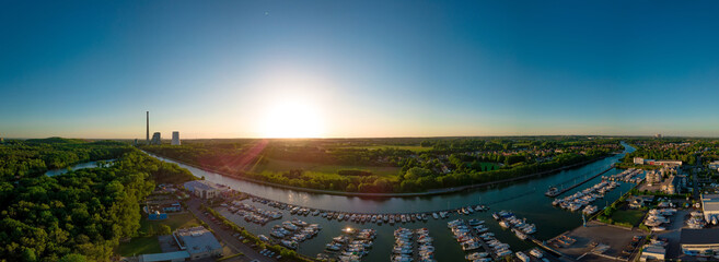 Panoramic sunset drone landscapes over the small yach tport in Luenen in Germany