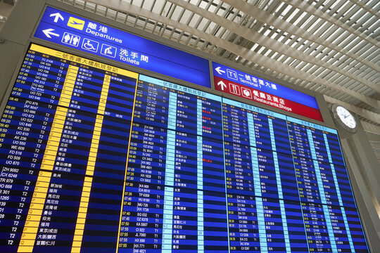 HONG KONG, CHINA - CIRCA JANUARY, 2019: flight schedule monitors in Hong Kong International Airport.