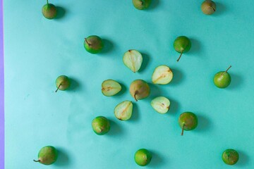 Pieces of pear on a blue background in the form of a pattern