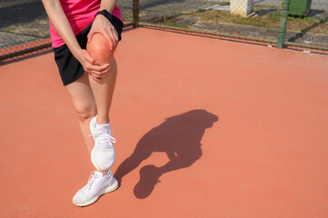 Cropped shot of woman runner suffering from knee pain. It often happens when your kneecap is out of alignment. Conceptual of common running injuries.