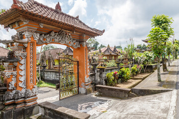 Fototapeta premium Entrance gate of a traditional Balinese house in Desa Katung in Kintamani, Bangli, Bali, Indonesia.