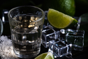 Brazilian cachaca in dark fume with lemons and salt