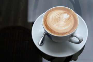 hot latte coffee drink put on table in cafe