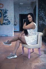 Fototapeta na wymiar young woman sitting on a chair