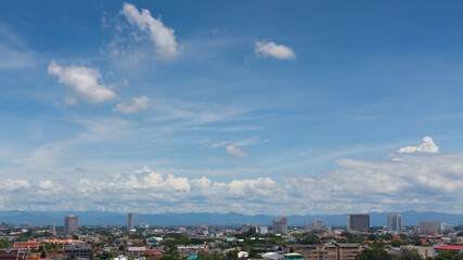 Naklejka na ściany i meble white cloud on blue sky above the town, aerial view cityscape