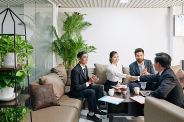 Excited business partners happy to conclude agreement after long nogotiations