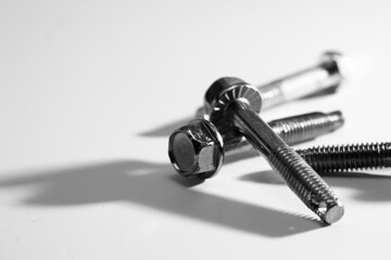 Metal screw on white background