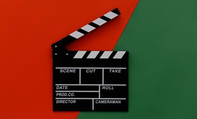 Fototapeta na wymiar Filmmaking concept. Movie Clapperboard. Cinema begins with movie clappers. Movie clapper on a green and on a red background.