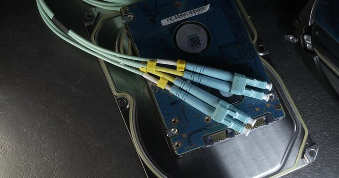Panning over Fiber cable and open Hard Drive, Data transfer and Data storage